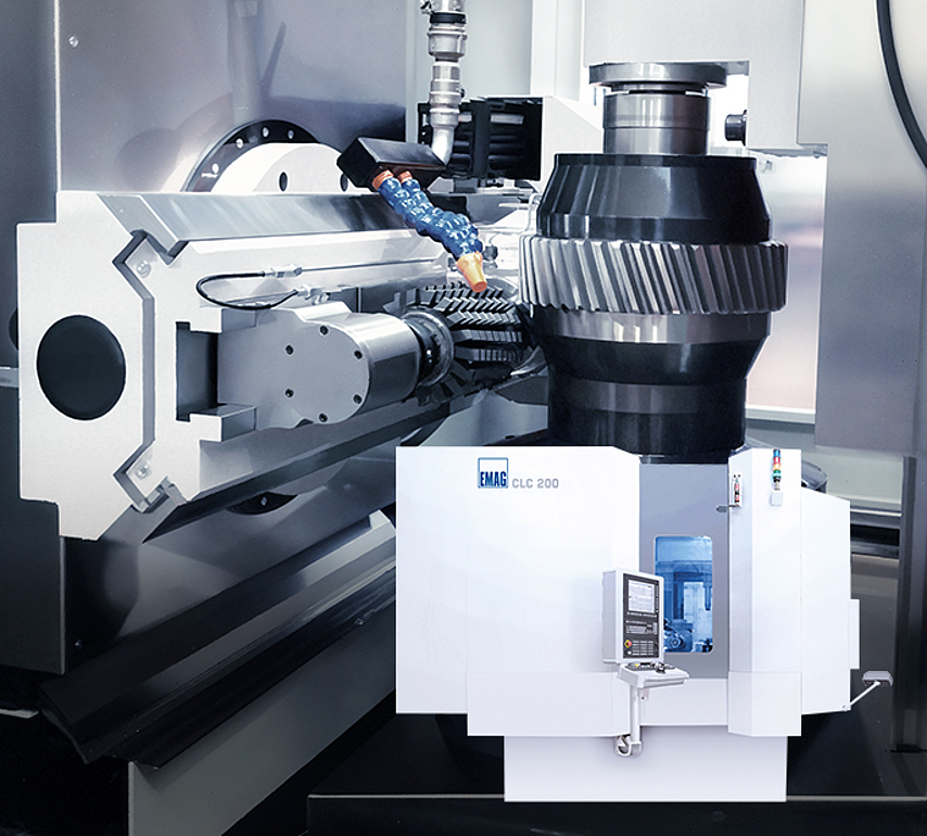CLC 200 gear hobbing machine performing gear cutting on a gear wheel. Vertical machine concept for batch production.