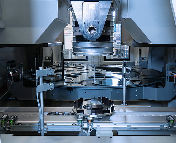 The components are aligned and centered with high precision in the vertical turning center.