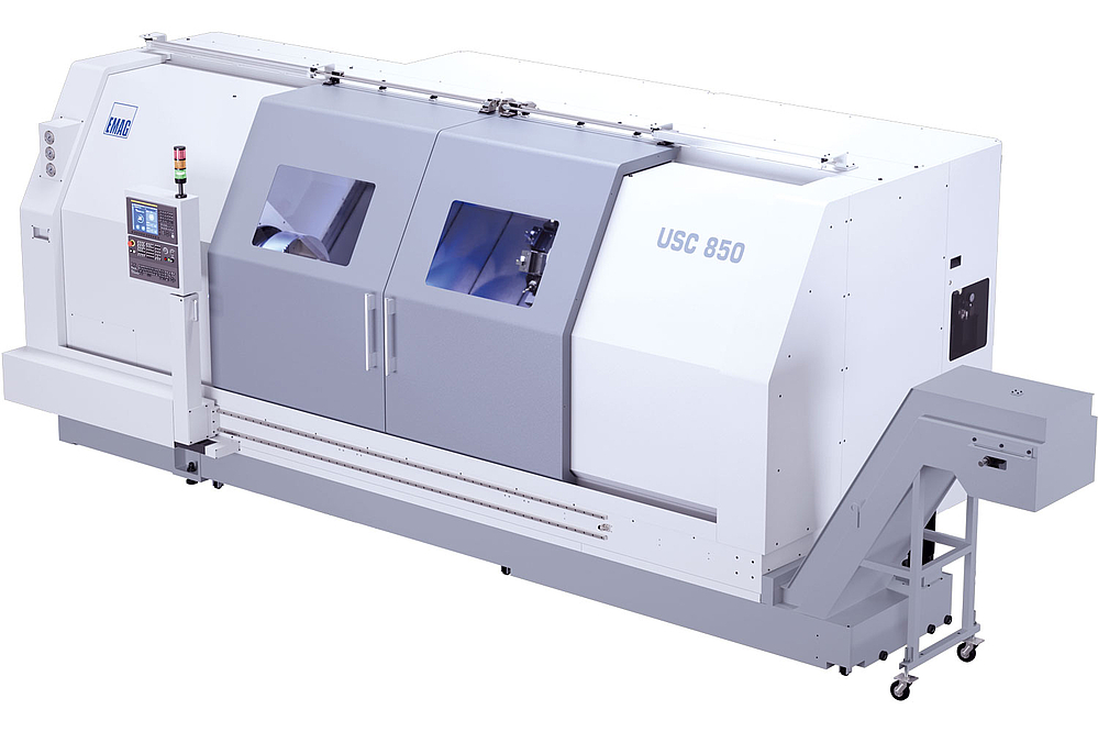 Vue extérieure du tour universel USC 850 avec espace travail fermé, un panneau de commande CNC moderne et une structure de machine stable pour un tournage précis. 